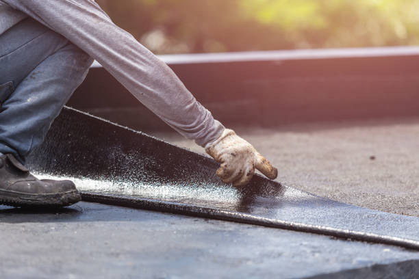 Professional Waterproofing technician working in Northport, AL